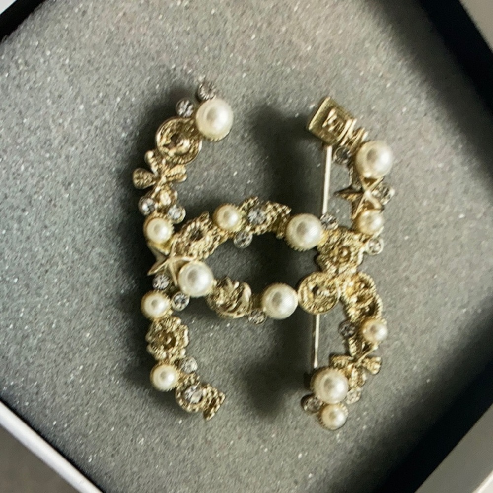 Chanel Gold brooches